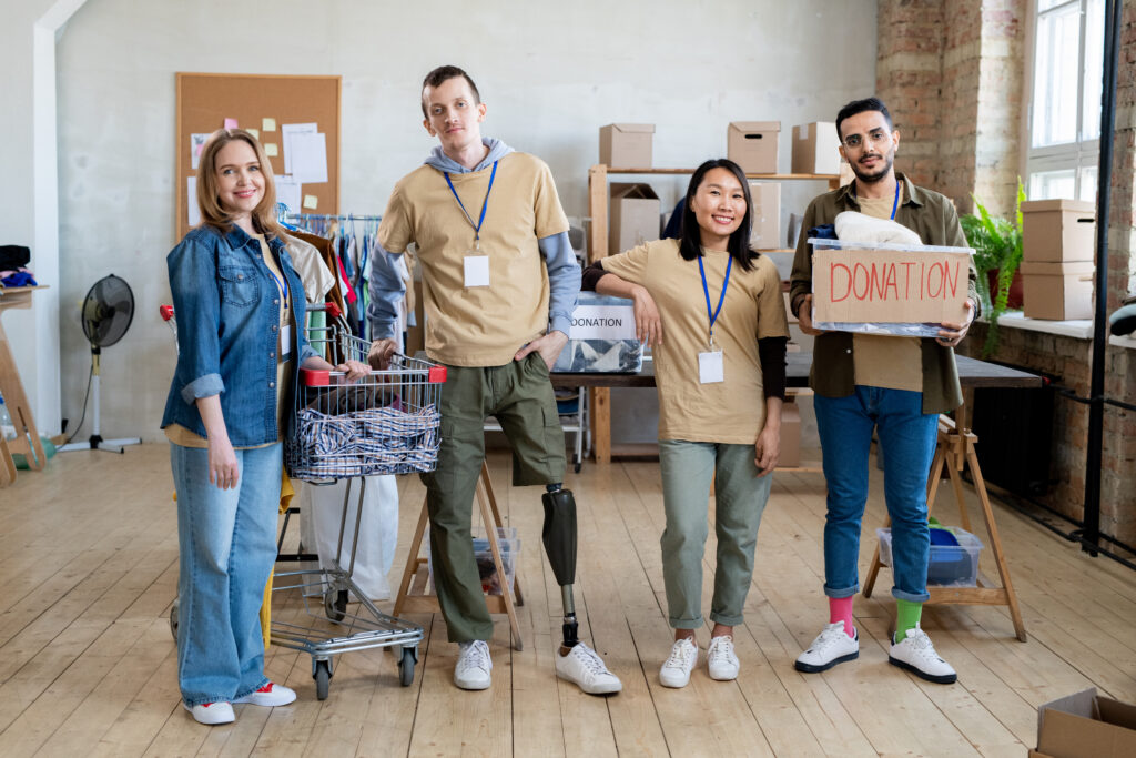 a group of people with donation clothes